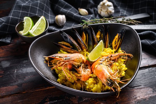 How to Master the Art of a Gourmet Spanish Paella with Saffron and Seafood?